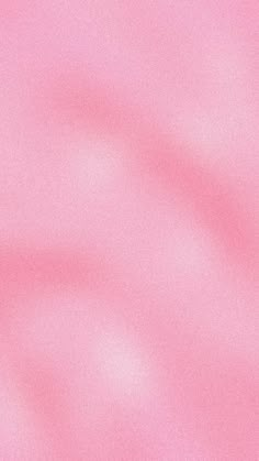 a blurry pink background is shown in this image