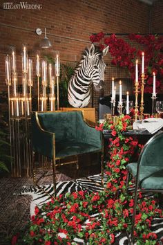 a zebra is standing in the middle of a room with chairs and flowers around it