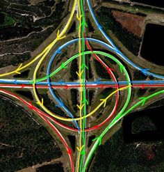 an aerial view of a street intersection with multiple colored lines on the center and sides