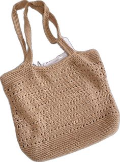 a crocheted bag is shown on a white background and has a long handle