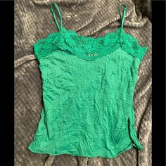 Excellent Condition Vintage Y2k Bongo Green Lace Cami Top. Super Gorgeous Bright Green Color And A Wrinkle Texture Material And Had Adjustable Spaghetti Straps. I Particularly Love That The Lace Goes All The Way Around And Not Just The Front Like Some I Have. Is A Juniors Szl So Fits Women Szs Which Is What I Am Now And Fits Perfectly. Only Getting Rid Of It Because Of A New Nasty Chest Scar. Can Save You $2.70 On Shipping If You Message Me. All Items Come Washed Unless Nwt Or Nwot. Smoke Free H Green Y2k Cami Top, Green Casual Camisole With Lace Trim, Casual Green Camisole With Lace Trim, Bright Green Color, Texture Material, Lace Cami Top, Fits Women, Lace Cami, Green Lace