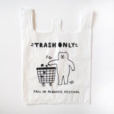 a white bag with an image of a bear pushing a shopping cart that says trash only