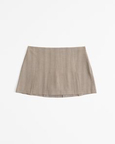 Mid rise mini skort in our herringbone fabric, featuring all-over pleating details, shorts lining for comfort and side zipper for a secure fit. Herringbone Fabric, Women's Bottoms, Suits Coats, Athletic Fits, Swimwear Accessories, American Apparel, Jacket Tops, Abercrombie Fitch, Herringbone