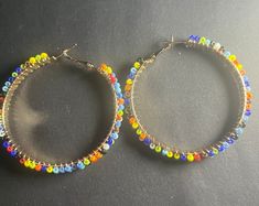 Native American Inspired Seed Bead Hoop Earrings - Etsy Nickel Free Multicolor Beaded Round Earrings, Trendy Multicolor Nickel-free Beaded Earrings, Trendy Multicolor Hoop Earrings For Festivals, Multicolor Wire Wrapped Hoop Earrings Gift, Multicolor Wire Wrapped Hoop Earrings For Gifts, Adjustable Multicolor Hoop Earrings, Adjustable Multicolor Beaded Earrings With Ear Wire, Multicolor Wire Wrapped Dangle Beaded Earrings, Multicolor Beaded Small Hoop Jewelry