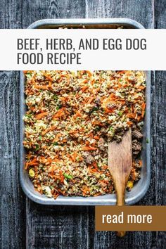 a casserole dish full of beef, herb and egg dog food with a wooden spoon