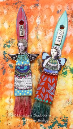 two painted angels holding surfboards on top of each other with words written in them