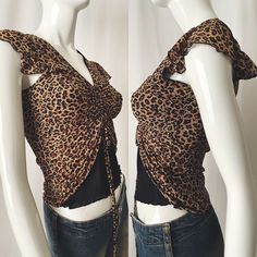 Animal print semi-sheer mesh top with fluttery cap sleeves and ruched (adjustable) front. Good used vintage condition with minimal to normal signs of wear  - Size S/M  - Nylon/Spandex  Please use the measurements provided to ensure fit. Measurements are taken with items lying flat, un taut. Measurements:   Waist 13" Underarm to underarm 16" Ruched Mesh Top, Y2k Leopard Print, Orange Leapard Skin Sheer Shirts, Leopard Print Mesh Top, Leopard Print Tank Top Y2k, Leopard Print V-neck Tops For Night Out, Sheer Mesh Top, Spring Zebra Print V-neck Top, Womens Blouses