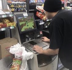 a man standing in front of a cash register