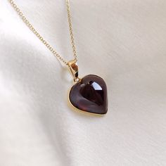 This stunning pendant is set in 14K Solid Yellow Gold with Natural Garnet with utmost precision. It is an unique gemstone pendant for nearly every occasion and is completely hassle-free jewelry. ITEM DETAILS * Gem: Garnet * Gem Size: 14X14mm * Gem Shape: Heart * Gem Weight: 11.61 carats * Gold Purity: 14KT  * Gold Weight: 0.59 gram * Total Weight of the Pendant: 2.91 gram The Gold purity is guaranteed and it comes with authentic 14KT gold hallmark. Since my items are handmade, they are absolutely nickel and lead free. CUSTOMIZATION * Gemstone customization is available and it can be substituted with a gem of your choice. Kindly message me for the same. PACKAGING * The Pendant comes with layers of safe and secure wrapping along with Free handmade jewelry box with every purchase. ➡️Head to t Fine Jewelry Amber Necklace For Anniversary, Amber Fine Jewelry Necklace For Anniversary, Amber Necklace Hallmarked For Anniversary, Amber Hallmarked Necklace For Anniversary, Pear-shaped Gemstone Jewelry For Valentine's Day, Amber Necklace With Polished Finish For Anniversary, Pear-shaped Jewelry For Valentine's Day Gift, Valentine's Day Pear-shaped Gemstone Jewelry, Valentine's Day Gift Pear-shaped Jewelry