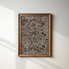 an abstract painting hanging on the wall