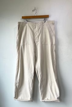 Japanese Workwear Wide Leg Cream Canvas Pants. Comfortable cotton fabric and wide leg design. An elevated staple piece for your closet. Features two pockets on front and two buttoned pockets on back. In excellent condition. Best fits Size L-XL but can be worn oversized. Approx Measurements: Waist: 17" Inseam: 35" Vintage Oversized Wide Leg Bottoms, Cotton Utility Style Wide-leg Pants, Cotton Utility Wide-leg Pants, Wide-leg Cotton Utility Pants, Utility Style Wide-leg Cotton Pants, Wide-leg Utility Cotton Pants, Utility Wide-leg Cotton Work Pants, Wide Leg Cotton Utility Work Pants, Cotton Utility Wide Leg Pants