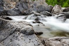 the water is running over rocks in this river bed, and it looks like they are moving