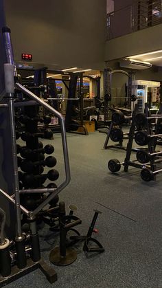 the gym is full of weight machines and exercise equipment