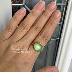 This designer J.Hengen ring features a glowing green beryl cabochon set in 18k solid gold. Ring Size: 6.75 Total Weight: 11.78 grams Precious Metal: 18k solid gold Precious stones: -Green Beryl Center Stone: 12 carats, 15mm x 13mm Hallmark: J Green Emerald Ring With Oval Cabochon Bezel Setting, Modern Yellow Gold Emerald Cabochon Ring, Modern Green Oval Cabochon Jewelry, Modern Green Cabochon Rings, Elegant Green Cabochon Moonstone Ring, Green Cabochon Moonstone Ring For Anniversary, Anniversary Green Cabochon Moonstone Ring, Estate Ring, Estate Rings