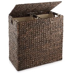 a brown woven storage basket with two bottles in it