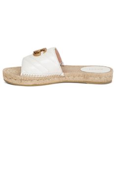 Finished with the emblematic Double G hardware, the platform espadrille mule is presented in soft matelassé chevron leathe.These shoes feature a raffia platform sole with ridged rubber base.Composition: Leather 100%Lining: Leather 100%, Cotton 100%Sole: Rubber 100%Designer Style ID: 551892BKO00Made in Spain Gucci Espadrilles, Chevron Outfit, Chevron Jewelry, Gucci Shop, Platform Espadrilles, Gg Logo, Leather Espadrilles, Luxury Women Fashion, Shoes Flats Sandals