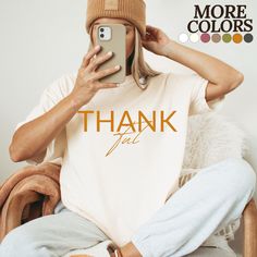 THANK YOU FOR SHOPPING WITH US Get ready to embrace the cozy and festive fall season with our, Thankful Thanksgiving t shirt! This t shirt is printed on a high-quality Comfort Colors t shirt, ensuring both style and comfort. The minimalistic font adds a touch of elegance to the simple statement of "Thankful". It's the perfect way to express how grateful you are for everyone and everything in a chic and subtle way, and it pairs great with hoop earrings. Get ready to capture the essence of fall in Thanksgiving Dinner Party, Thanksgiving Color, Thanksgiving Family, Pumpkin Picking, Thanksgiving Christmas, Apple Picking, Thanksgiving Shirts, Fall Gifts, Thanksgiving Gifts