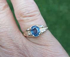 Finding a Montana Sapphire over 1ct in size is getting harder to come by, but here it is.  This medium blue Montana Sapphire is 1.35 cts, 5 x 7 mm oval, set in 14 kt gold.  This beauty will look good on your finger! A8 Blue Sapphire Ring With Vvs Clarity In 14k Gold, Blue 14k Stamped Promise Ring, Blue Sapphire Ring Stamped 14k For Gift, Blue Sapphire Ring Stamped 14k, 14k Gold Blue Sapphire Ring With Center Stone, Blue Birthstone Ring With Center Stone In 14k Gold, Hallmarked 14k Gold Blue Topaz Ring, Heirloom 14k Gold Blue Sapphire Ring, Oval Blue Sapphire Ring With Diamond Cut