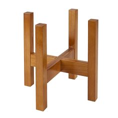 a small wooden table with two legs on each side and one leg raised up to the ground