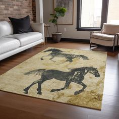 a living room with white couches and a rug on the floor