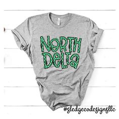 EXCLUSIVE: NORTH DELTA GREENWAVES POLKA DOTA | Custom Unisex Tshirt These are SOFT prints! No screen print and no vinyl! Made to Last! All our items are made to order. We print on the highest quality fabrics ranging from softstyle, Independent, Tulex, Royce Brand,Next Level, Comfort Colors, and many more! Almost all our items and designs are made in house.Designs are exclusively hand drawn or made in house for each team/school/item.As we continue to try to deliver our customers exclusive designs,we ask that our artwork is not to be copied.If you would like something drawn for you or your organization, pleaseReach out to us @ sledgecodesigns@gmail.com __________________________________________________________ FAQS | IN THE KNOW: Please allow 2-3 weeks for delivery, during busy seasons.We tr School Spirit Wear, State School, Dress Appropriately, Spirit Wear, Co Design, Unisex Tshirt, School Spirit, House Designs, Royce