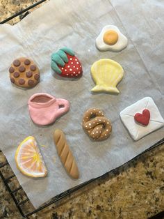 some cookies and pastries are sitting on a paper towel