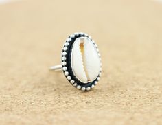 This is a bohemian sterling silver ring with a Cowrie Shell! *It has been made from scratch by me using sterling silver sheet and wire. *Ring's band measure 15mm *Finished with a black patina and brought to a shine. *Choose your ring size at checkout! *This ring is made to order.Please about 1 week to have it ready for you.It will come beautifully gift wrapped for you or your beloved. Thank you so much for stopping by ! Sea Ring, Twisted Wire Rings, Sea Rings, Shell Ring, Bohemian Beach, Rose Quartz Ring, Bohemian Rings, Wide Band Rings, Cowrie Shell