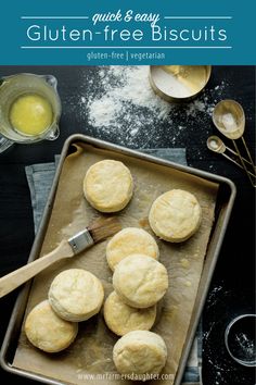 gluten - free biscuits on a baking sheet with a spatula