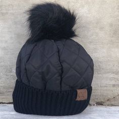 Stay cozy and incredibly chic in our CC Quilted Pom Beanie! It comes with authentic C.C® branding and quality, a faux fur pom (that you can remove for a different look!), and a wind-resistant inner fleece lining for that extra warmth. The pom comes with a snap so it is easy to put on or take off. PRODUCT FEATURES: Authentic C.C ® Branding & Quality Quality Faux Fur Pom Removable Pom Wind Resistant Inner Fleece Lining for Complete Warmth SIZING: One Size Fits Most C.C ® Tag || Fits Size Youth 5/6 Black Faux Fur Hat For Fall, Casual Winter Hat With Faux Fur Trim, Casual Faux Fur Hats For Cold Weather, Pom Beanie, Fur Pom Pom, Stay Cozy, Beanie Hats, Put On, Product Features