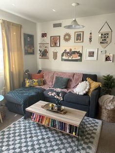 a living room filled with furniture and lots of pictures on the wall above it's coffee table