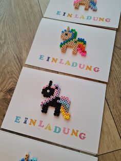 three different types of beaded greeting cards on a wooden floor with the words enladding