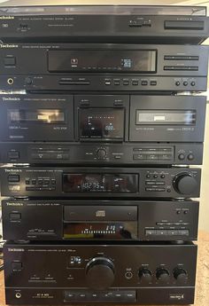 a stack of stereos sitting on top of each other