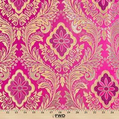 a pink and gold wallpaper with large flowers on the bottom, in an ornate pattern