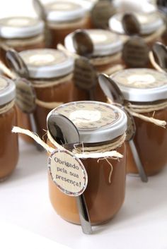 several jars filled with peanut butter sitting on top of a table