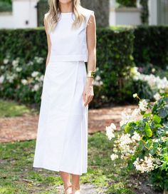 Elegant Spring Wrap Skirt For Daywear, Chic Pleated Wrap Skirt For Spring, Spring Fitted Midi Wrap Skirt, Chic Midi Length Wrap Skirt For Workwear, Fitted Spring Midi Wrap Skirt, Fitted Midi Length Wrap Skirt For Work, Fitted Midi Wrap Skirt For Work, Elegant White Wrap Skirt For Spring, White Asymmetrical Wrap Skirt For Spring