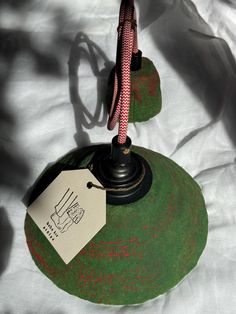 a close up of a lamp with a tag on it