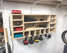 there are many tools hanging on the wall