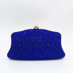 Indulge in the celestial allure of the Jane Crystals Clutch Bag – a shimmering masterpiece from every angle. Bedazzled with sparkling crystals, this handbag commands attention as a captivating statement piece. Its mesmerizing design guarantees all eyes gravitate towards you as you make your grand entrance. And with the addition of a chic chain strap, you can effortlessly carry it while dancing the night away, exuding sophistication with every step. Exclusively available in blue. Sparkling Crystal Bags For Party, Glamorous Evening Bags With Crystal, Glamorous Sparkling Bags For Night Out, Sparkling Crystal Evening Bag For Events, Glamorous Crystal Embellished Bags, Crystal Evening Handheld Bag, Evening Handheld Bags With Bling, Sparkling Clutch For Night Out, Sparkling Crystal Evening Bag