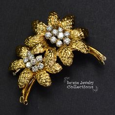 This yellow 18k gold Vintage GUBELIN Diamond Flower Brooch is simply stunning and rare! The two flowers each have 8 to 9 sparkly white diamond rounds in the middle totaling 1.78 carats that bring the brooch to life. Total Weight: 23.68 grams Size: 2 inches tall, 1.7 inch wide Precious Metal: 18k yellow gold Precious stones: -White Round Diamonds Elegant Diamond Flower Brooch, Elegant Diamond Flower Brooches, Diamond Flower Brooch For Formal Occasions, Formal Diamond Flower Brooch, Luxury Formal Flower-shaped Brooches, Exquisite Diamond Brooches In Yellow Gold, Exquisite Yellow Gold Diamond Brooches, Yellow Gold Diamond Brooches For Formal Occasions, Formal Yellow Gold Diamond Brooch