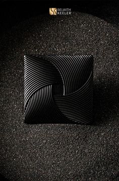 a black card holder sitting on top of a carpet