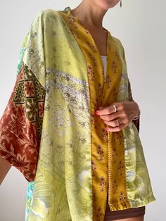 this is colorful light silk kimono shirt made of vintage saree silk  made one of a kind , unisex style for both men and ladies  Looks great with skirt as well as trousers or shorts  Suitable to wear, all year round as a lightweight topper shirt Original hippie boho style great for summer festivals travels or every day very comfortable, made in one free size in soft and floaty fabric  Thank you for looking Festival Kimono With Green Patchwork, Festival Green Kimono With Patchwork, Summer Topper, Kimono Shirt, Light Silk, Patchwork Shirt, Light Coat, Summer Festival, Kimonos