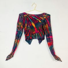 Tie Dye V-neck Top For Beach, Fitted Multicolor Blouse For Festival, Colorful Fitted Bohemian Tops, Fitted Multicolor Print Beach Top, Colorful Fitted Long Sleeve Tops, Multicolor Long Sleeve Stretch Crop Top, Multicolor Long Sleeve Crop Top For Vacation, Tie Dye Long Sleeve Tops For Festival, Multicolor Stretch Long Sleeve Crop Top