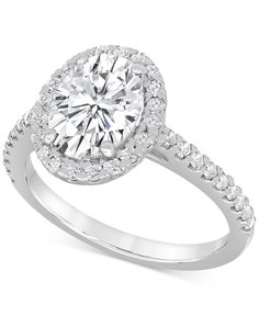 a round cut diamond ring with pave set shoulders