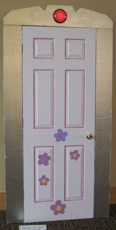 a white door with flowers painted on it