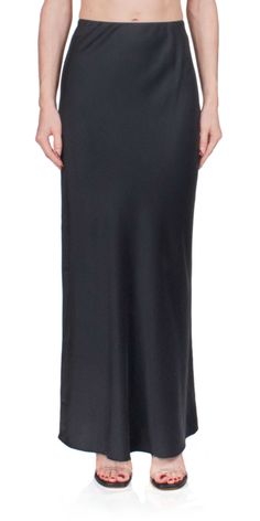 The Bias Slip Skirt from St. Agni is an elegant and timeless addition to any wardrobe, designed to provide maximum comfort and effortless style. Featuring a bias cut with slim fit, maxi length, and hidden elastic waist, it provides a cascading, mercurial effect. The subtle flare at the hem adds the perfect finishing touch. Details: Color: Black 62% Silk / 29% FSC Viscose / 9% Elastane; Lining: 100% Lyocell Elastic waistband Vendor Code: R24-804BLK Fits true to size Model is 5ft 5in and is wearin Corporate Fashion, Spring Knits, St Agni, Holiday Party Outfit, Slip Skirt, Wardrobe Design, Hair Fragrance, Effortless Style, Denim Dress