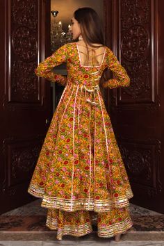 Mustard full sleeve all over botanical floral print anarkali kurta. Comes with co-ordinating flared palazzo and organza dupatta. - Aza Fashions Floral Print Anarkali, Plazzo Set, Anarkali Dresses, Flared Palazzo, Sewing Easy, Function Dresses, Trendy Outfits Indian, Indian Kurti, Outfits Indian