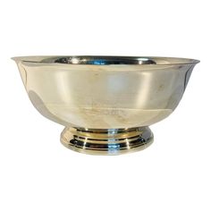 a silver bowl sitting on top of a table