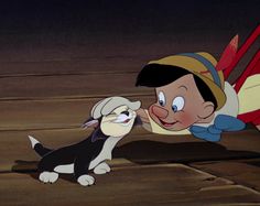 an animated character is petting a dog on the nose in front of a wooden floor