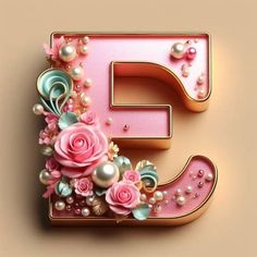 the letter e is decorated with pink flowers and pearls on a light brown background,