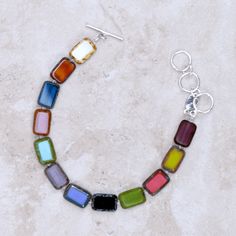 The Pamela Bracelet has gorgeous custom Czech glass beads, and each one is an individual work of art, made wearable just for you! Multicolor Sterling silver toggle clasp Czech glass beads Colors may vary slightly Adjusts from 7.25 inches to 8.5 inches Handmade in Martha's Vineyard If you like the Pamela Bracelet, shop our other handmade jewelry here! Adjustable Nickel Free Glass Bracelets, Adjustable Glass Beaded Bracelets Nickel Free, Glass Bracelet With Lobster Clasp As Gift, Multicolor Czech Glass Bracelets With Unique Variations, Silver Bracelet With Colorful Glass Beads, Multicolor Czech Glass Jewelry With Lobster Clasp, Everyday Multicolor Beaded Bracelets With Lobster Clasp, Everyday Multicolor Beaded Bracelet With Lobster Clasp, Everyday Multicolor Glass Jewelry